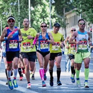 group of people running on the street