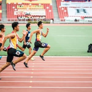 group of men running in track field