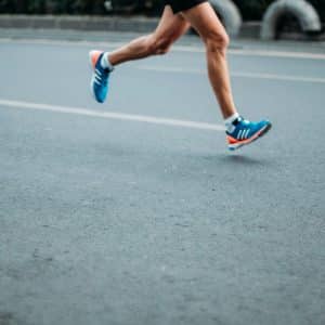 pair of blue-and-white Adidas running shoes